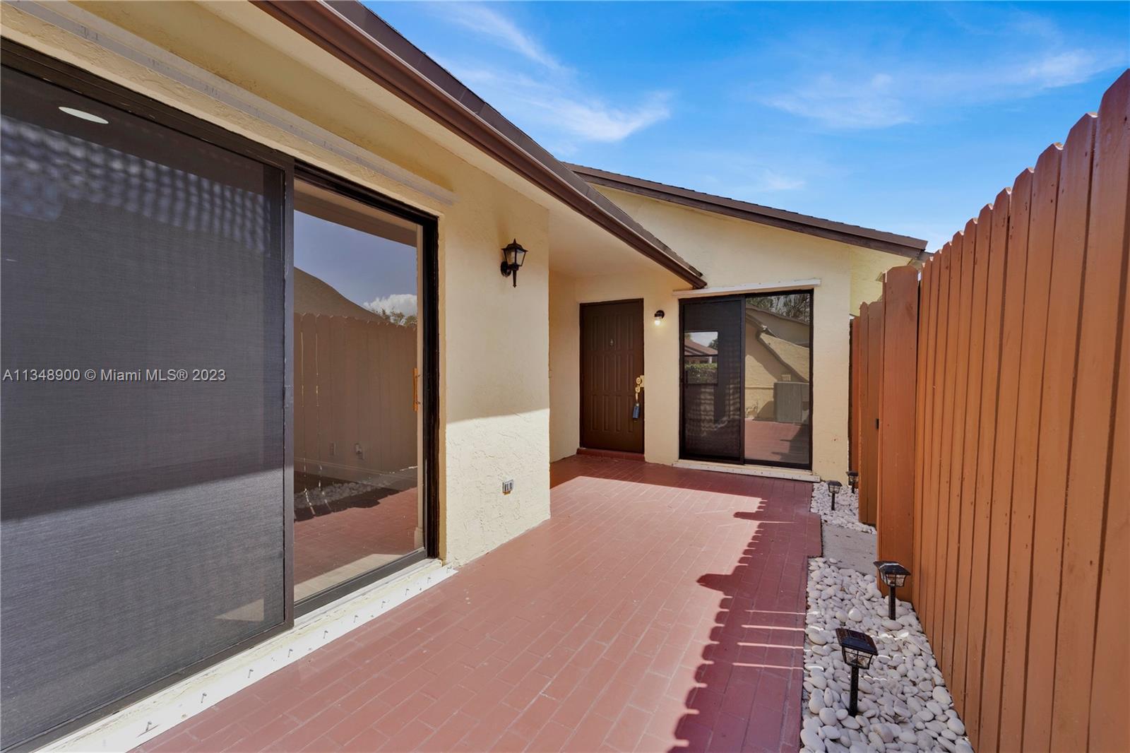 464 Springdale Circle, Unit 46D Palm Springs, FL 33461 - Photo 2 of 21 a view of a hallway with wooden walls