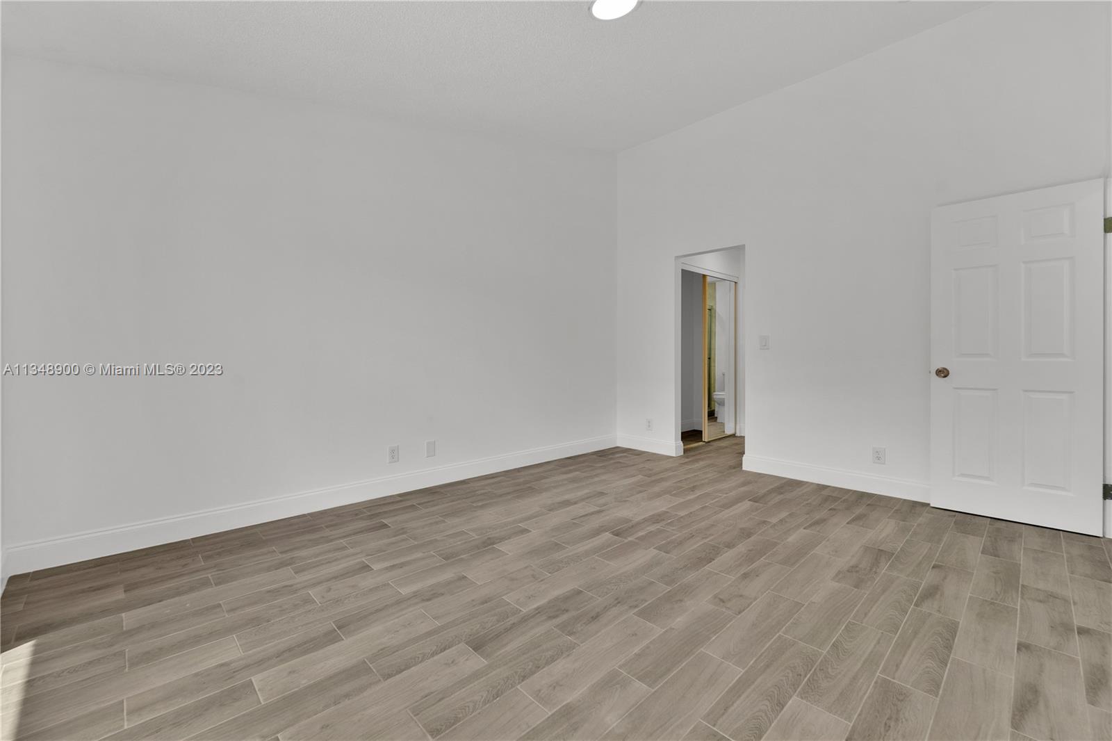 464 Springdale Circle, Unit 46D Palm Springs, FL 33461 - Photo 10 of 21 wooden floor in an empty room