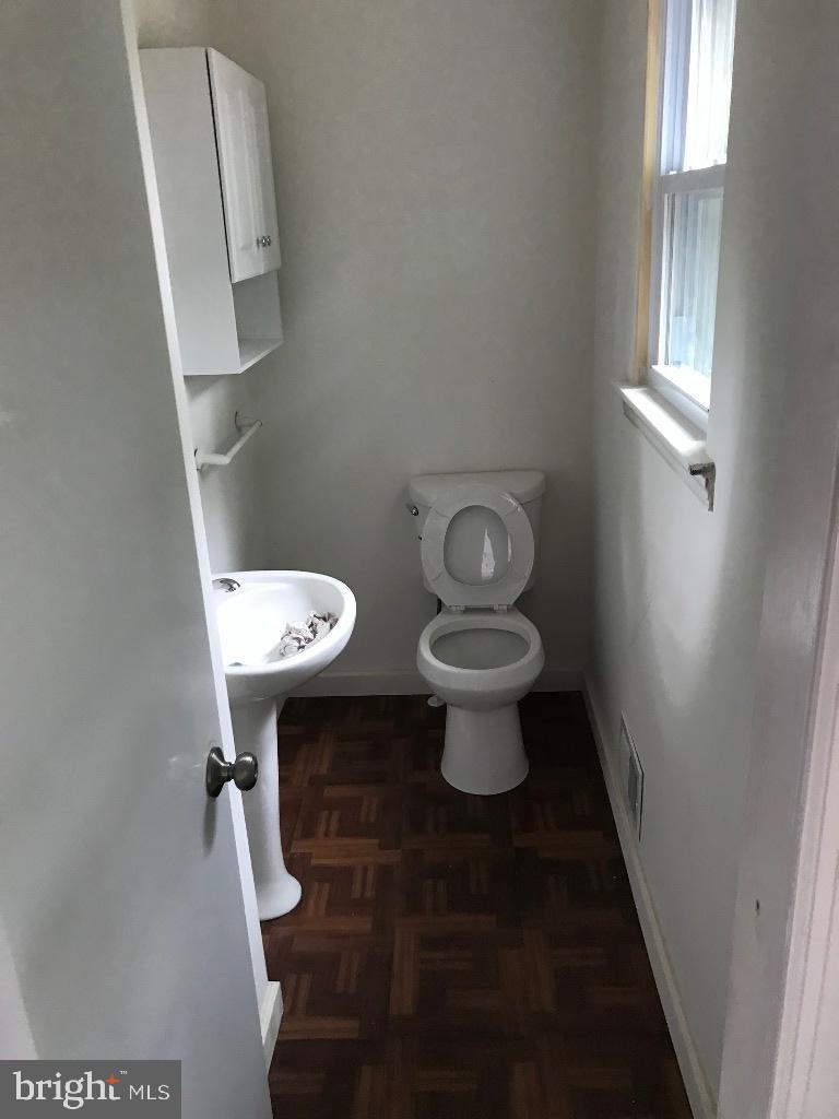 408 Villanova Road Glassboro, NJ 08028 - Photo 11 of 18 a white toilet sitting next to a window