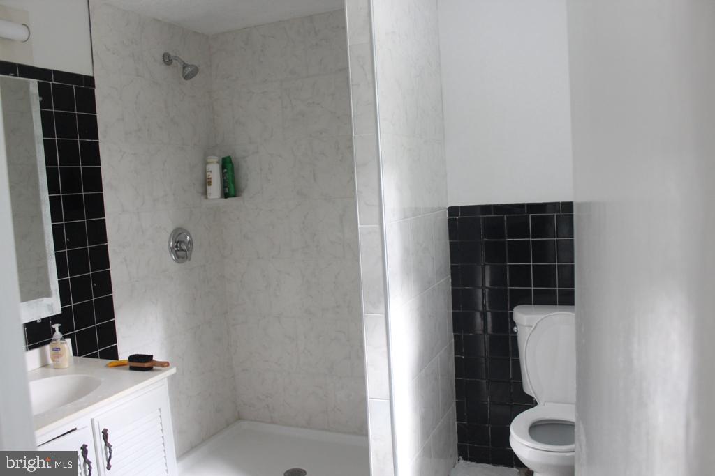 408 Villanova Road Glassboro, NJ 08028 - Photo 18 of 18 a bathroom with a toilet and a shower