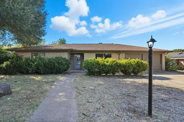a view of a house with a street