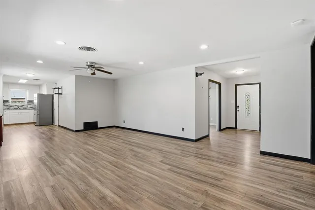 a view of a livingroom with wooden floor