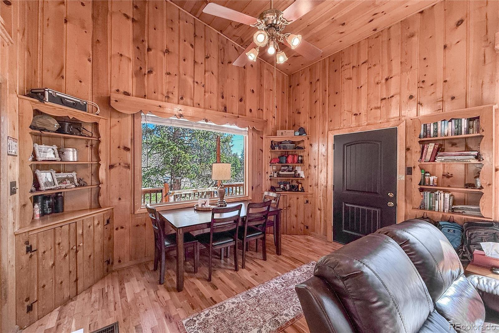 3148 Riverside Drive Lyons, CO 80540 - Photo 12 of 41 a view of a dining room with furniture window and wooden floor