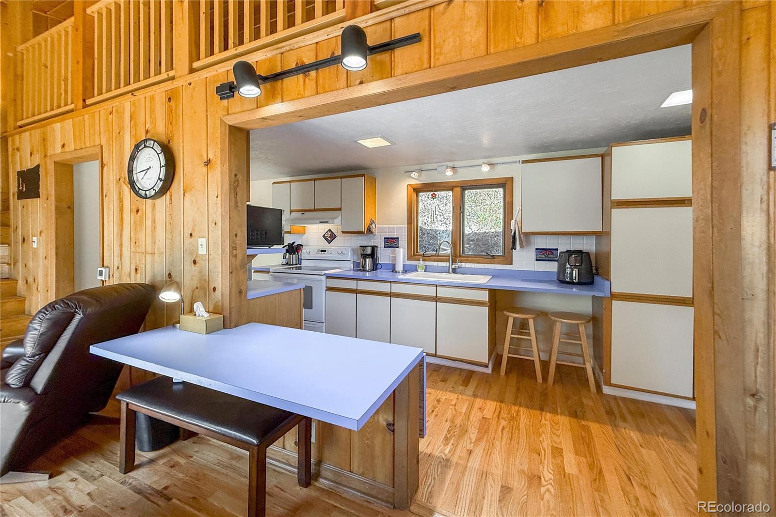 3148 Riverside Drive Lyons, CO 80540 - Photo 22 of 41 a open kitchen with a table chairs and a refrigerator