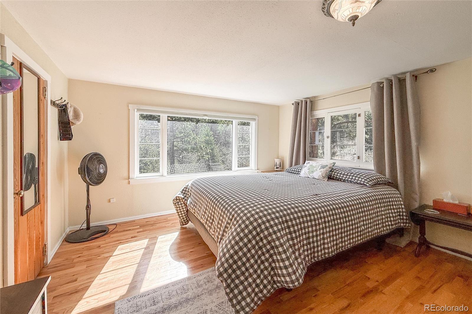 3148 Riverside Drive Lyons, CO 80540 - Photo 25 of 41 a bedroom with a bed and a window