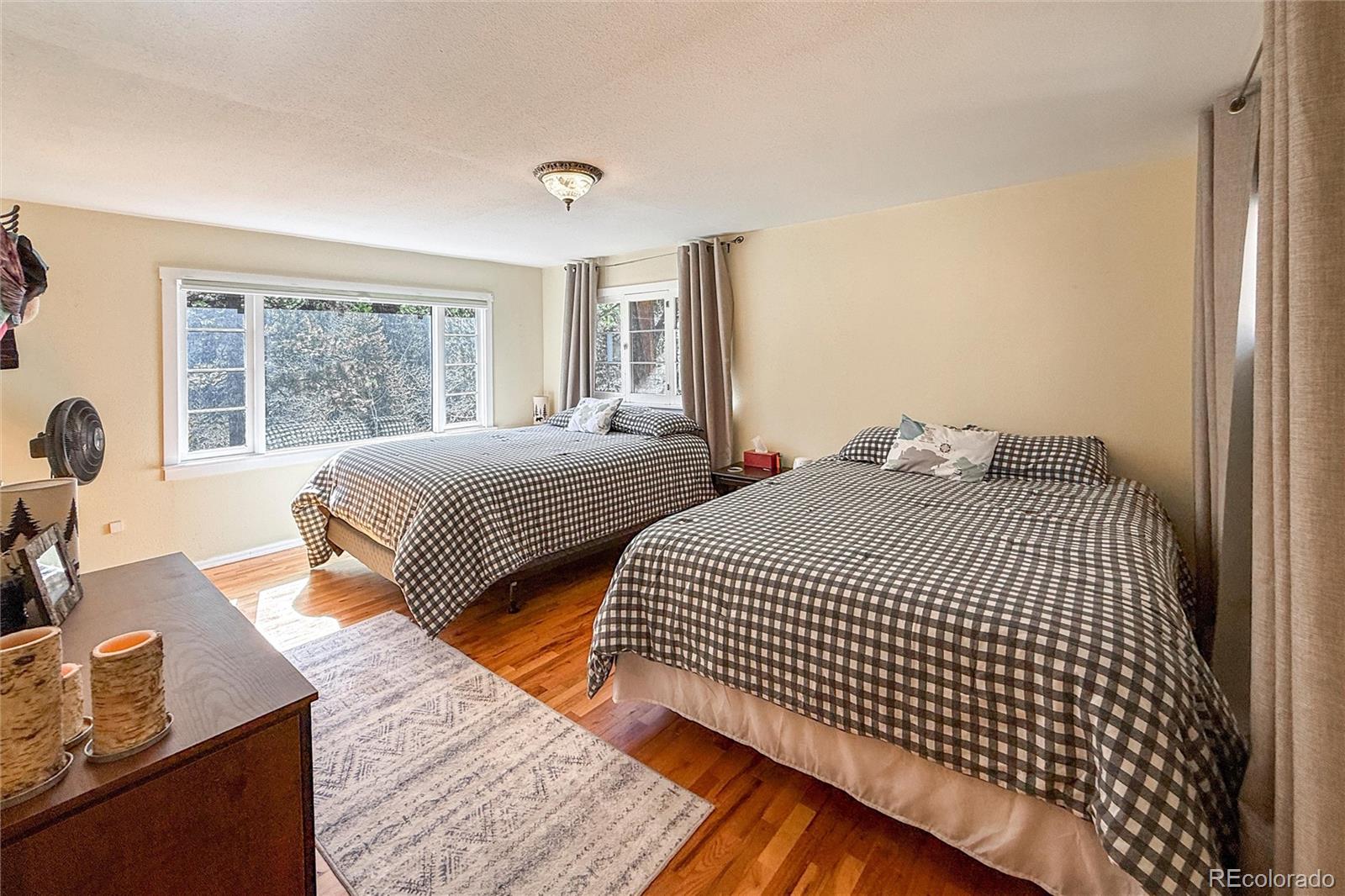 3148 Riverside Drive Lyons, CO 80540 - Photo 26 of 41 a bedroom with double bed and a large window