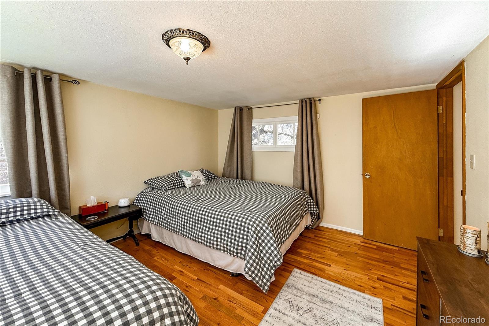 3148 Riverside Drive Lyons, CO 80540 - Photo 27 of 41 a bedroom with bed and window