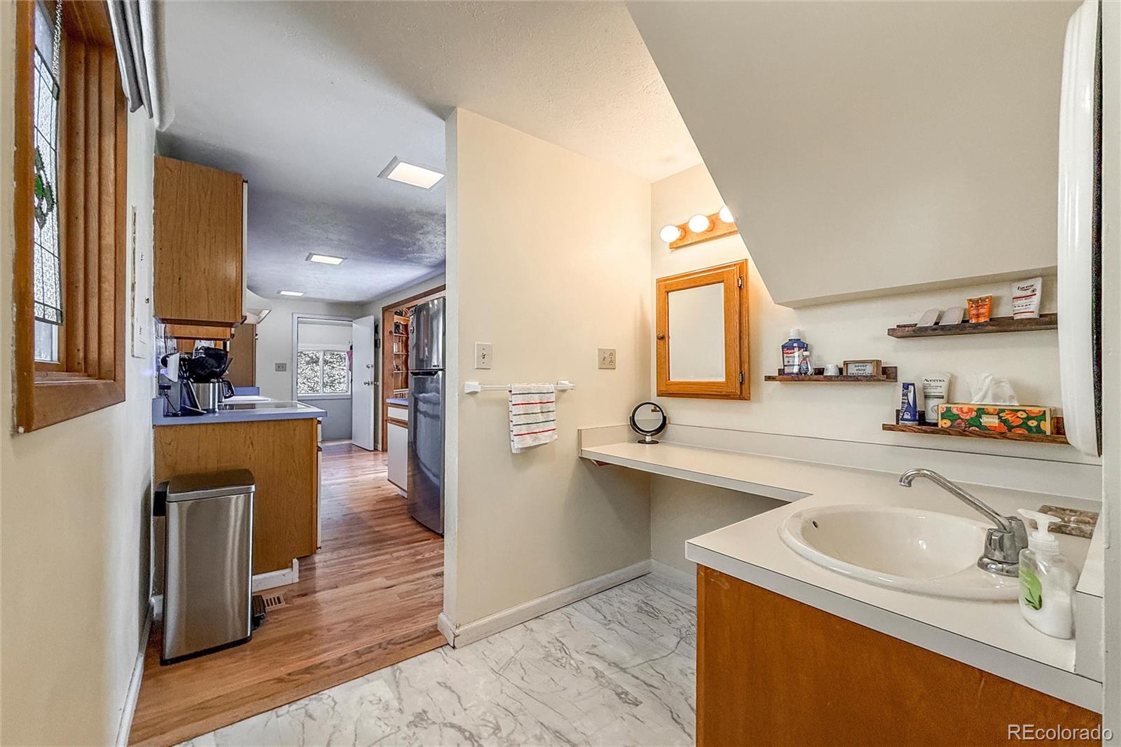3148 Riverside Drive Lyons, CO 80540 - Photo 28 of 41 a kitchen with stainless steel appliances granite countertop a sink a stove and a refrigerator