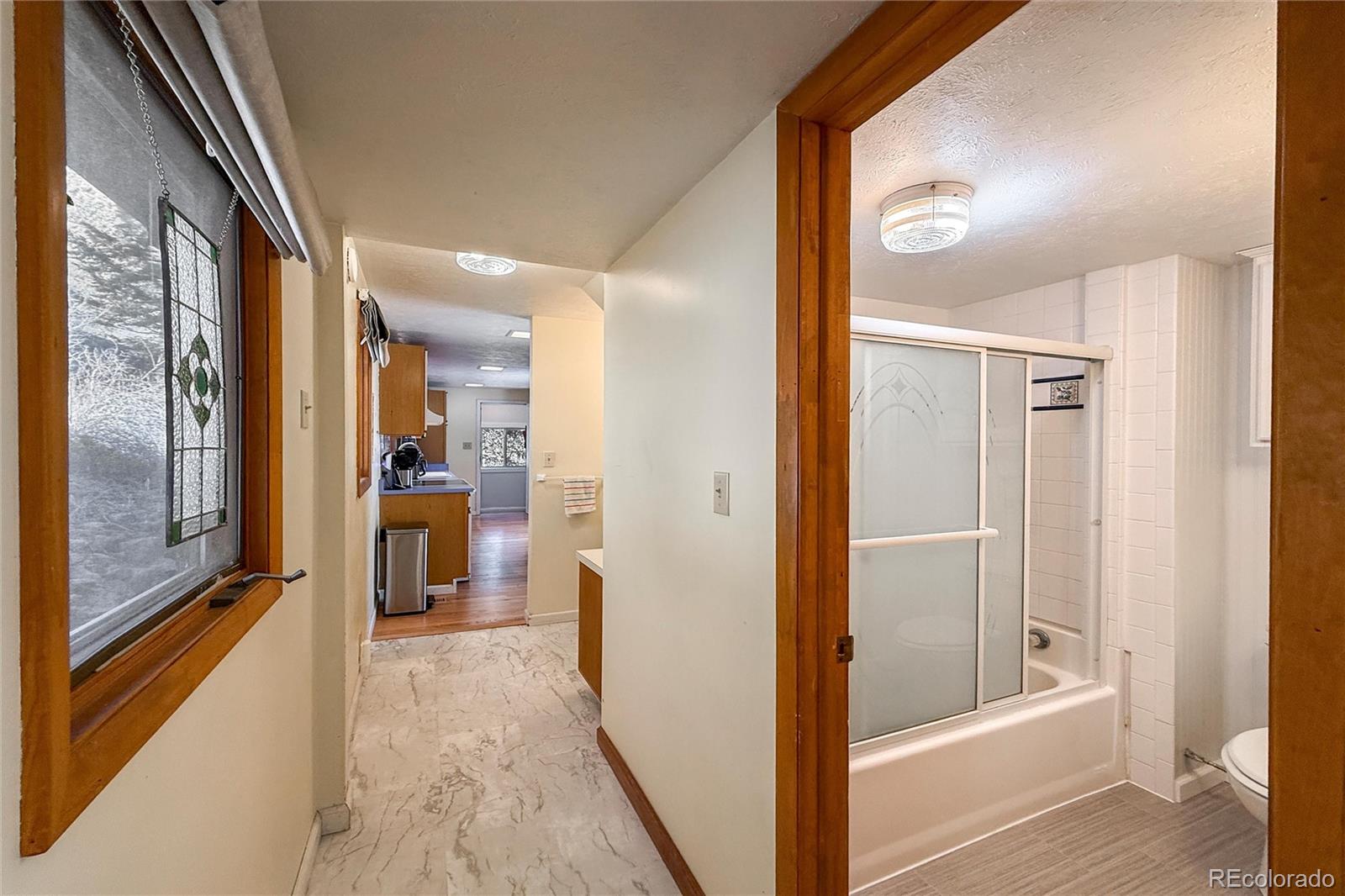 3148 Riverside Drive Lyons, CO 80540 - Photo 29 of 41 a bathroom with a bathtub and a shower