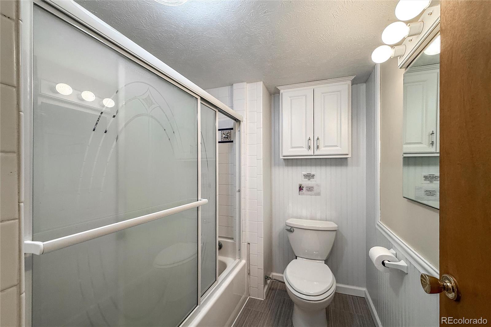3148 Riverside Drive Lyons, CO 80540 - Photo 30 of 41 a bathroom with a toilet a sink and shower