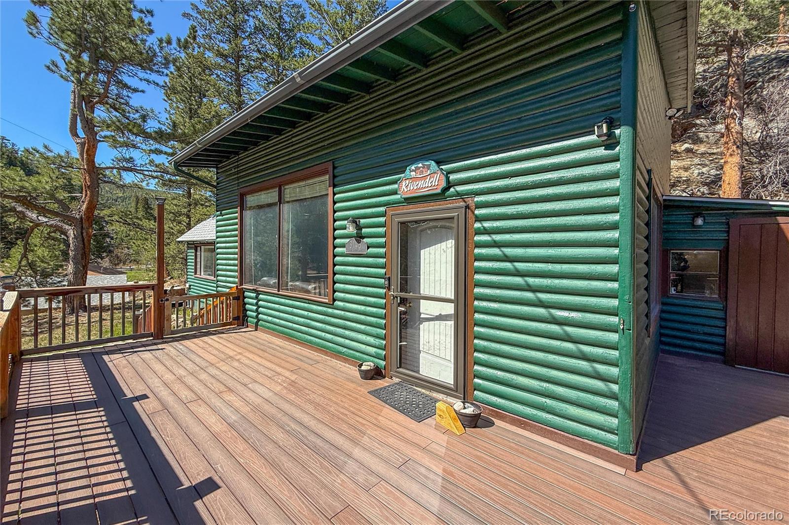 3148 Riverside Drive Lyons, CO 80540 - Photo 7 of 41 a view of a backyard with a deck