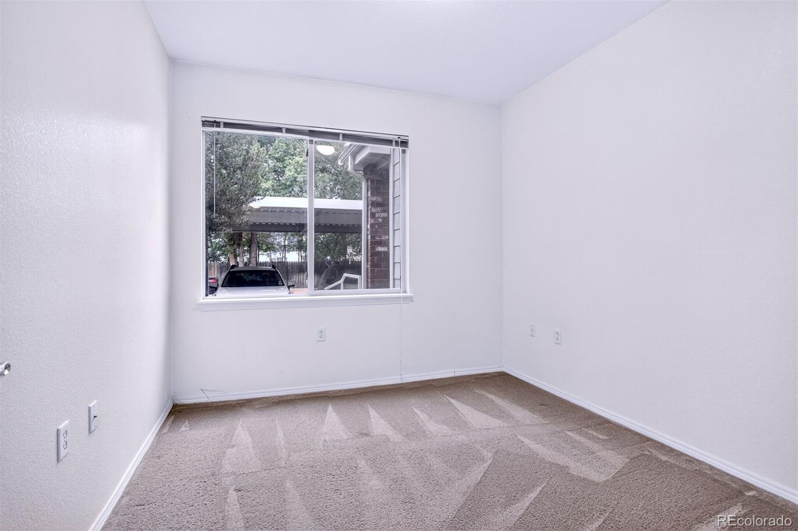 5320 Allison Street, Unit 106 Arvada, CO 80002 - Photo 12 of 15 an empty room with a window