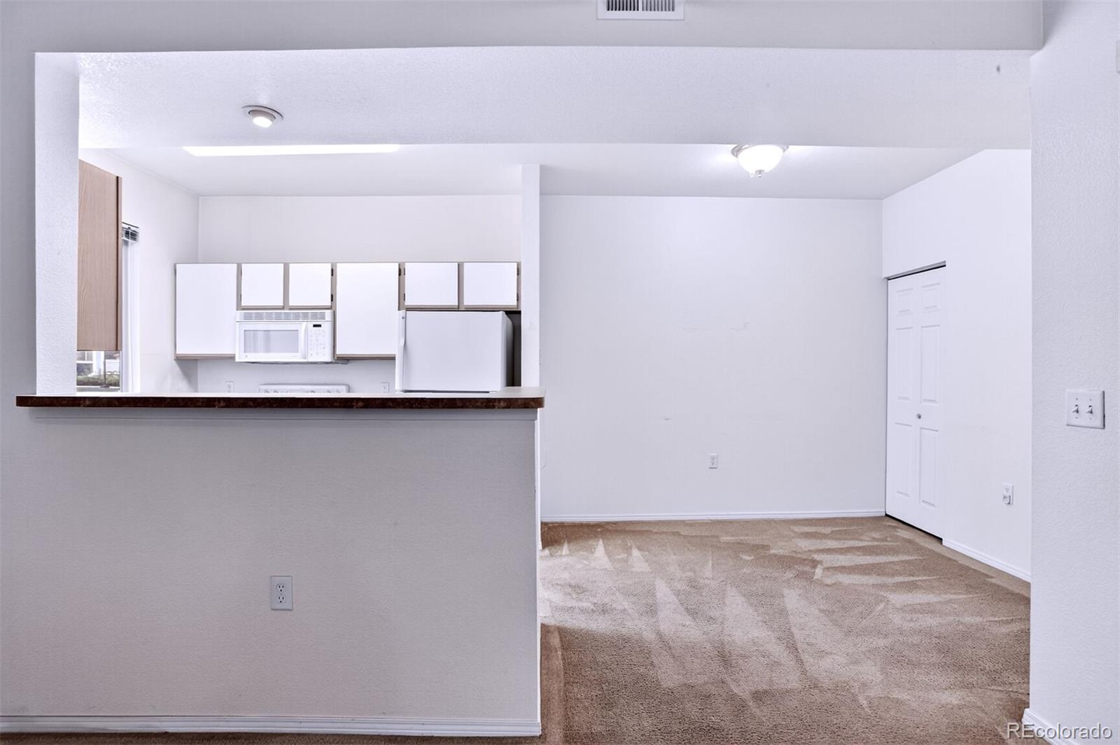 5320 Allison Street, Unit 106 Arvada, CO 80002 - Photo 4 of 15 a view of an empty room
