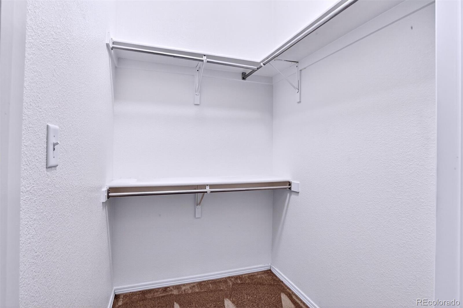 5320 Allison Street, Unit 106 Arvada, CO 80002 - Photo 10 of 15 a view of a room with shelf