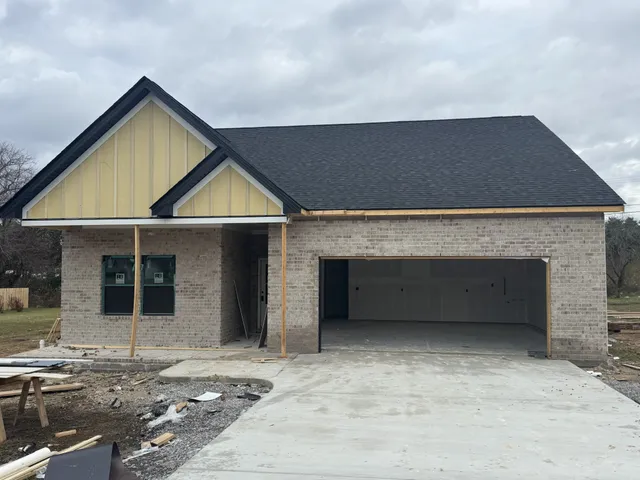 a view of outdoor space and front view of a house