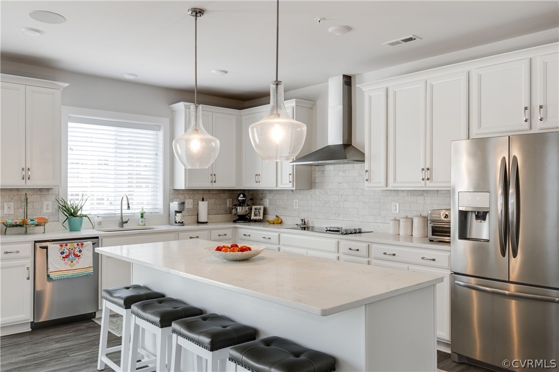 4332 Saunders Station Loop, Unit B Henrico, VA 23233 - Photo 15 of 42 a kitchen with a sink a stove and chairs