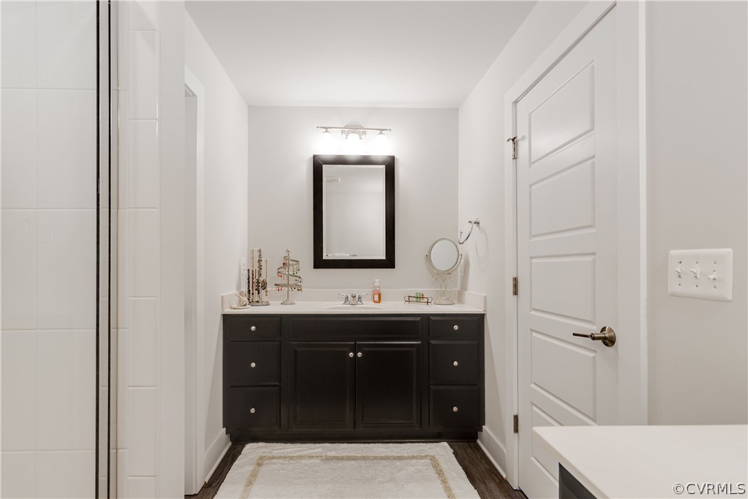 4332 Saunders Station Loop, Unit B Henrico, VA 23233 - Photo 30 of 42 a bathroom with a sink and a mirror