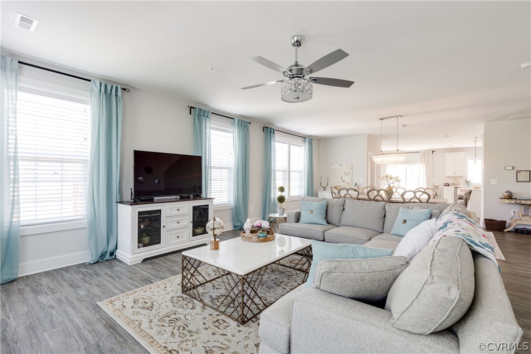 4332 Saunders Station Loop, Unit B Henrico, VA 23233 - Photo 5 of 42 a living room with furniture a flat screen tv and a window