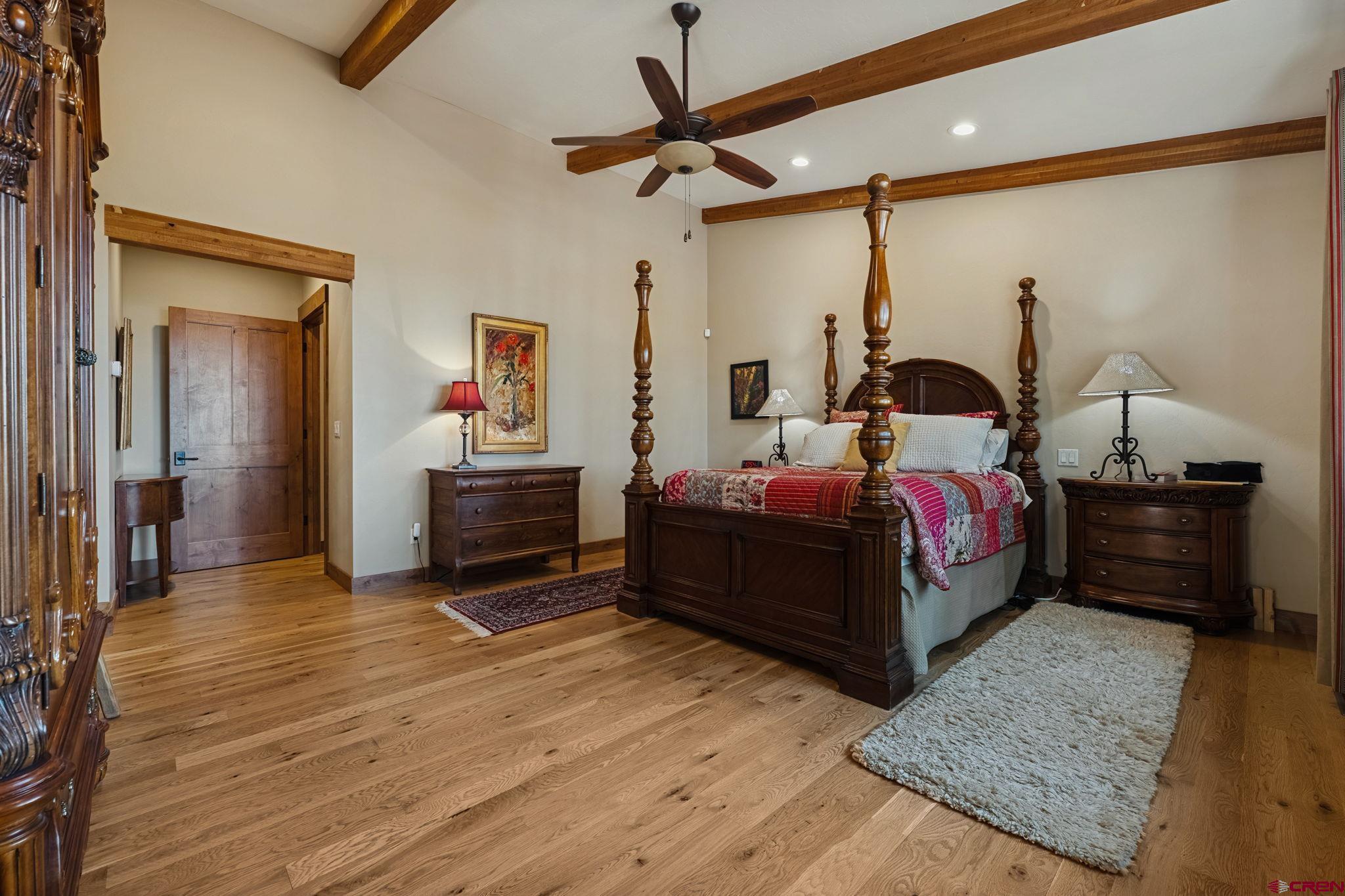 449 Monarch Crest Trail Durango, CO 81301 - Photo 17 of 45 a bed room with a bed window and a mirror