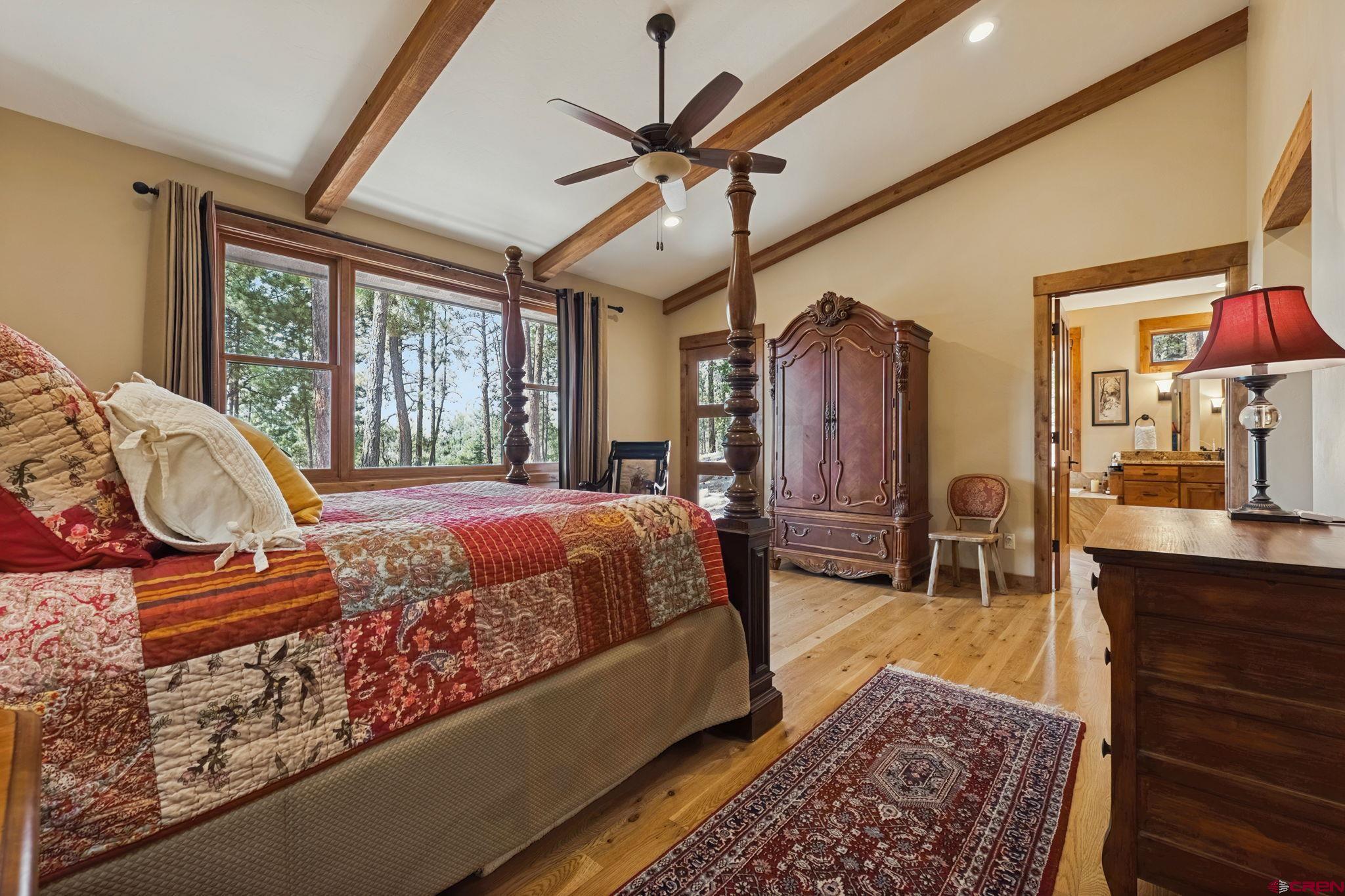 449 Monarch Crest Trail Durango, CO 81301 - Photo 36 of 45 a bed sitting in a bedroom next to a window