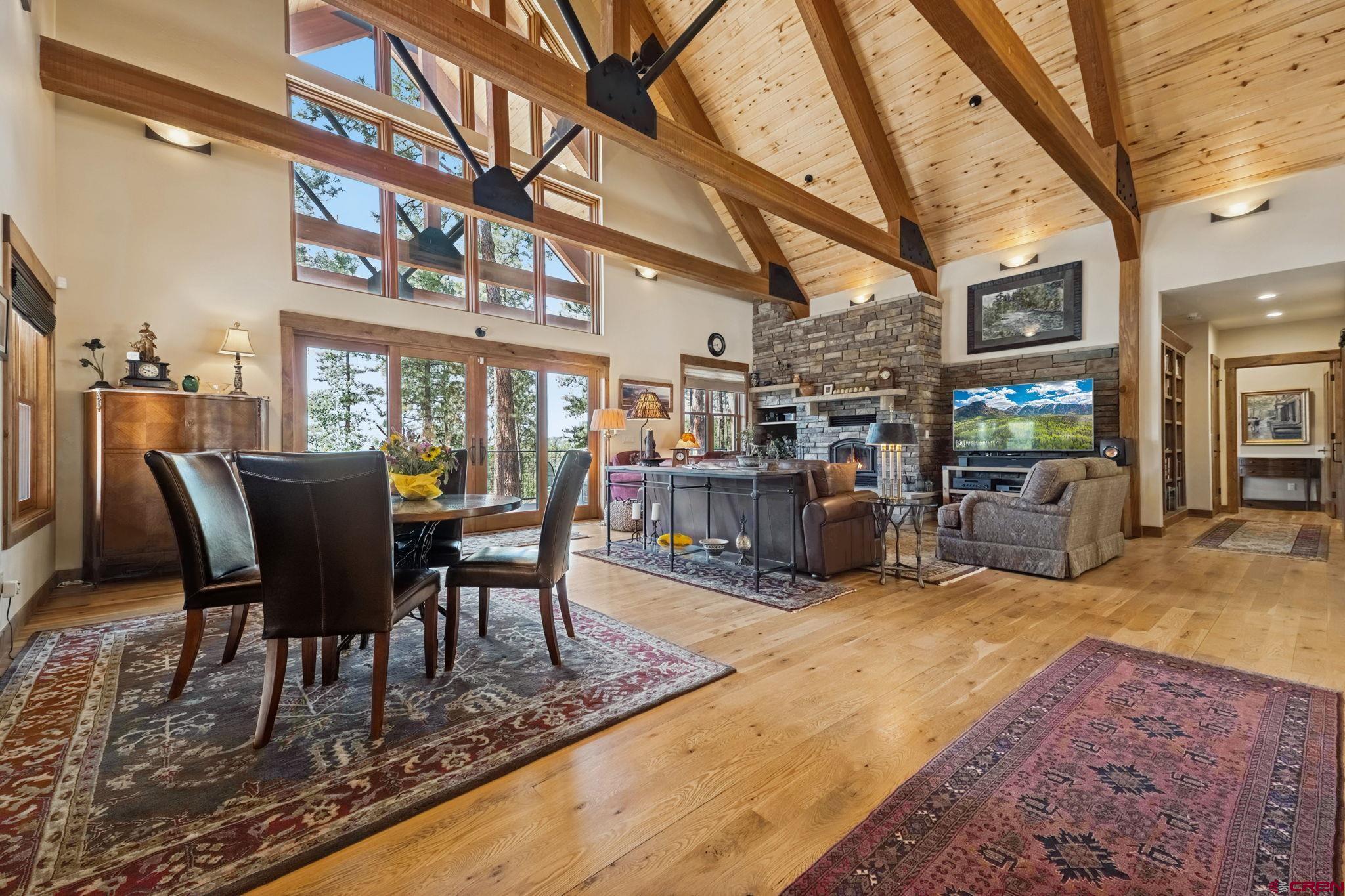 449 Monarch Crest Trail Durango, CO 81301 - Photo 4 of 45 a view of a dining room with furniture and a kitchen