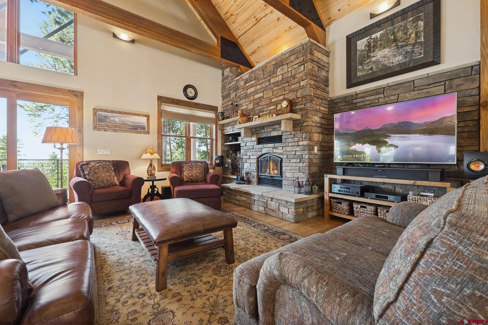 449 Monarch Crest Trail Durango, CO 81301 - Photo 5 of 45 a living room with furniture and a flat screen tv