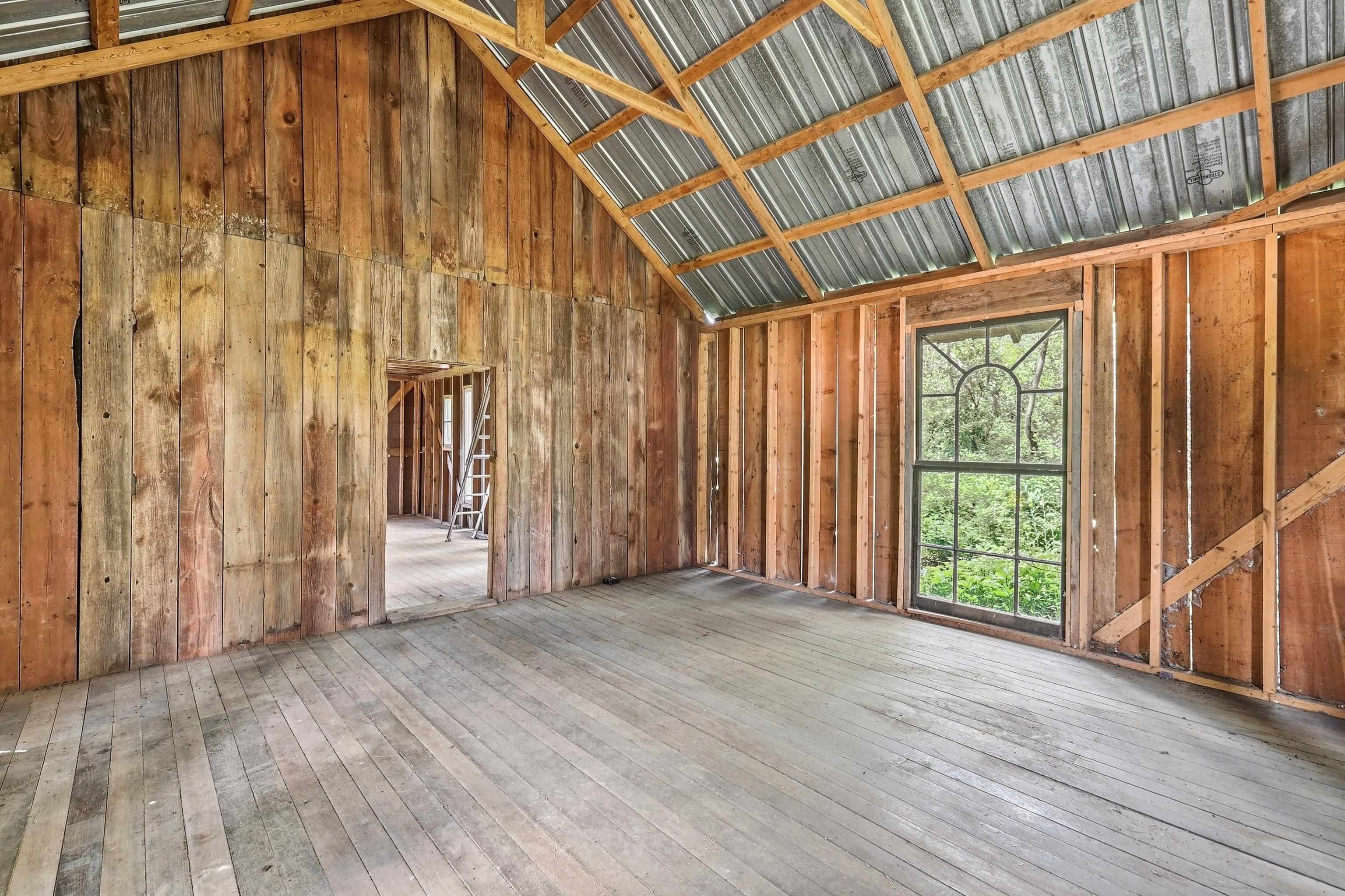 2562 West Blackjack Road Galena, IL 61036 - Photo 55 of 75 a view of an empty room with wooden floor and a window
