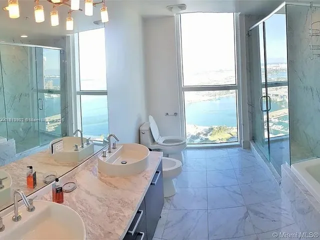 a dining room with a table and chairs