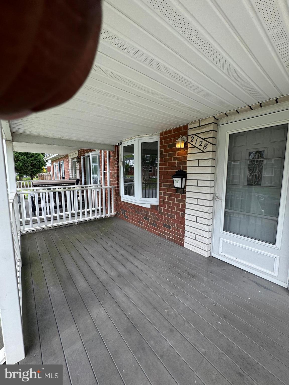2128 Cockspur Road Middle River, MD 21220 - Photo 27 of 28 a view of a house with porch and wooden floor