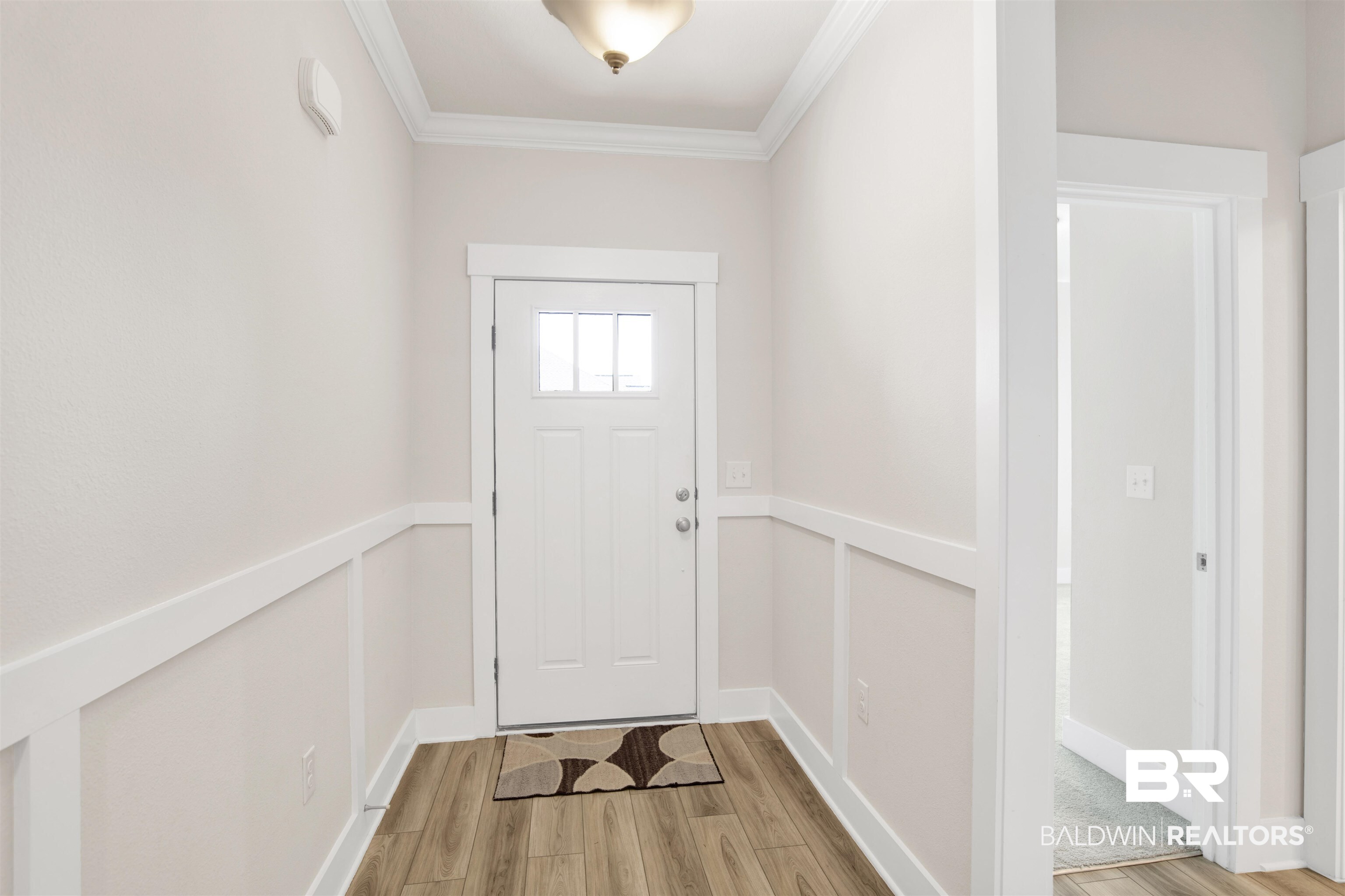 1174 Pheasant Circle Foley, AL 36535 - Photo 5 of 29 Doorway featuring wood finished floors and ornamental molding
