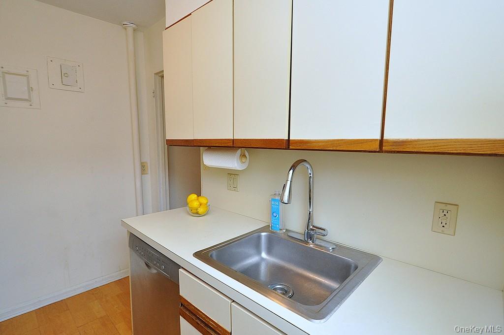 235 Garth Road, Unit D5E Scarsdale, NY 10583 - Photo 11 of 49 The kitchen has stainless steel appliances and window for ventilation and natural light.