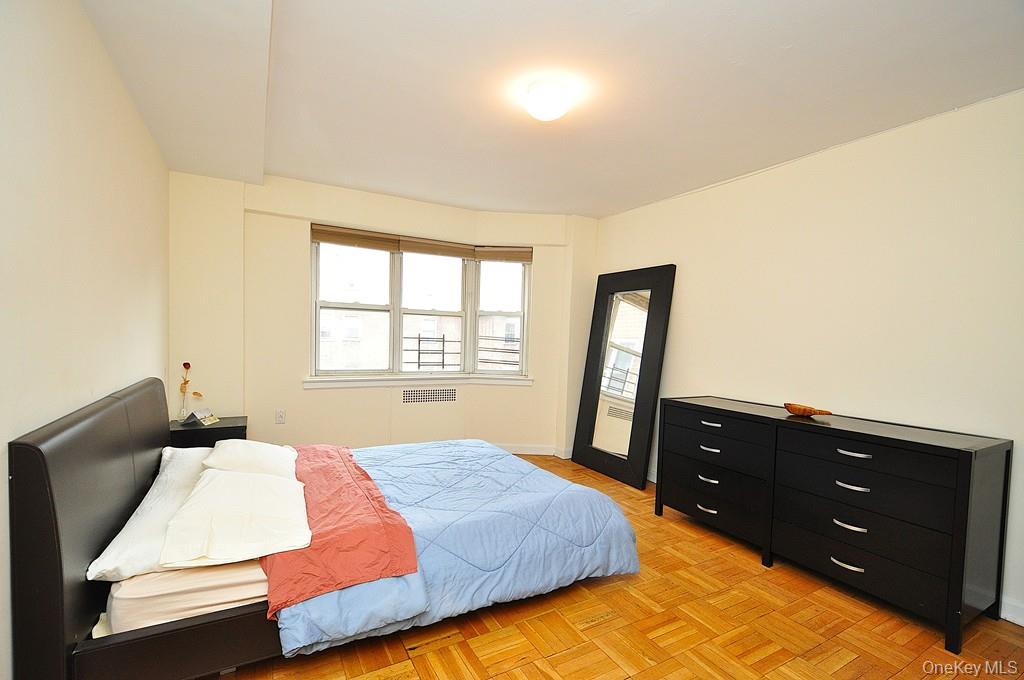 235 Garth Road, Unit D5E Scarsdale, NY 10583 - Photo 25 of 49 Large Bedroom has two closets and parquet floors. The bedroom is approx. 12' x 15"