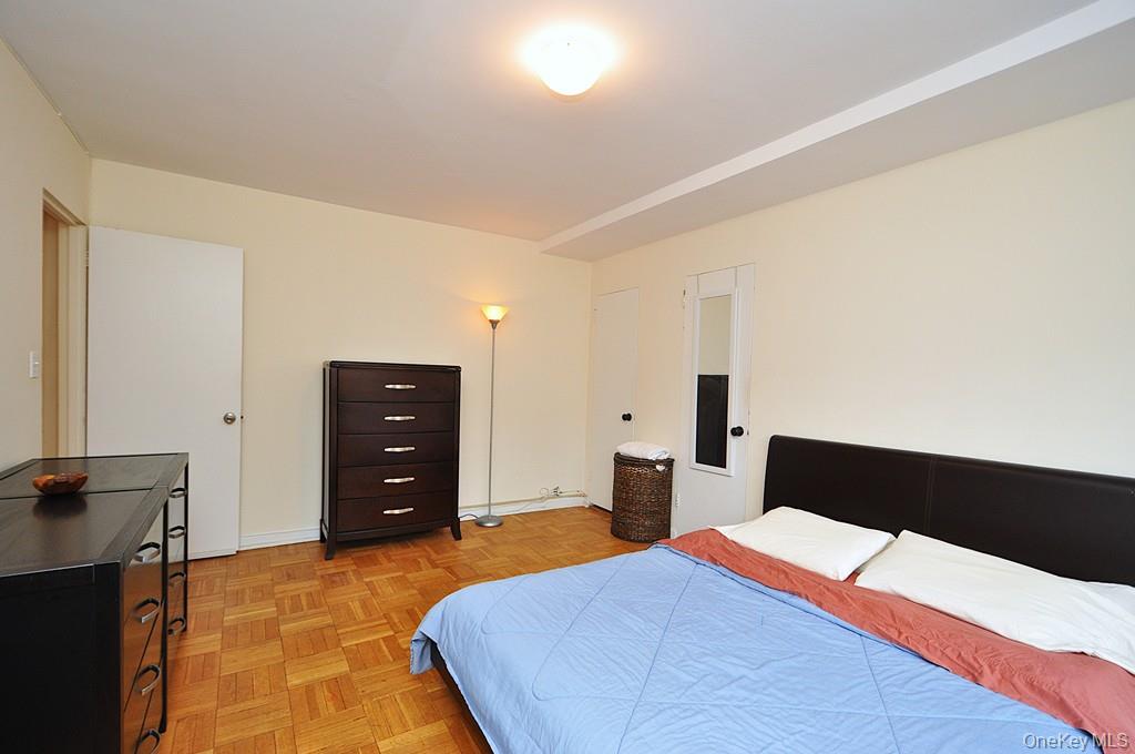 235 Garth Road, Unit D5E Scarsdale, NY 10583 - Photo 26 of 49 Large Bedroom has two closets and parquet floors. The bedroom is approx. 12' x 15"