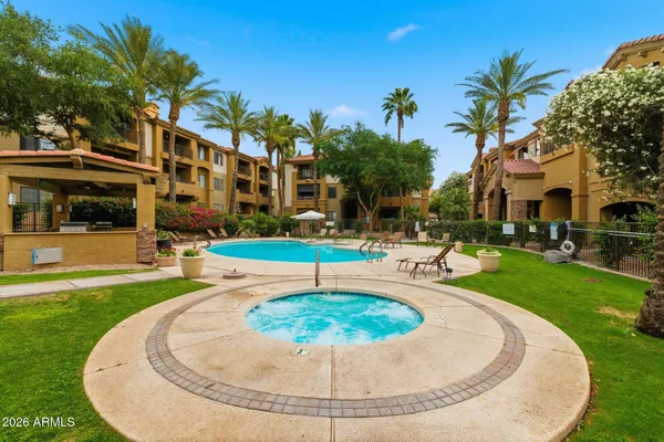 a view of a swimming pool with a yard