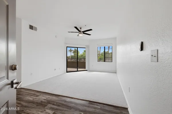 a view of an empty room with a window