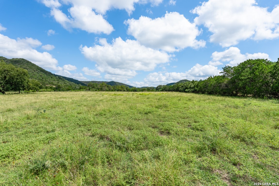 5013 North Little Creek Road Utopia, TX 78884 - Photo 21 of 39 a view of a lake with a big yard