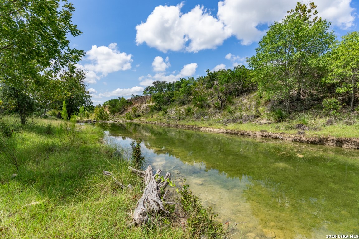 5013 North Little Creek Road Utopia, TX 78884 - Photo 5 of 39 a view of a lake from a yard