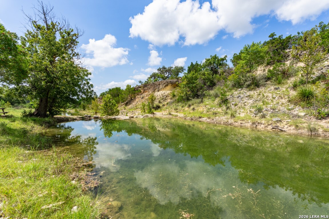 5013 North Little Creek Road Utopia, TX 78884 - Photo 7 of 39 a view of a lake with a yard