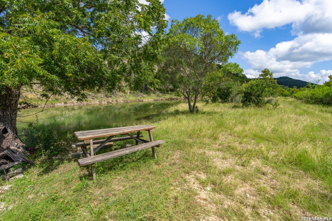 5013 North Little Creek Road Utopia, TX 78884 - Photo 8 of 39 a backyard of a house with lots of green space