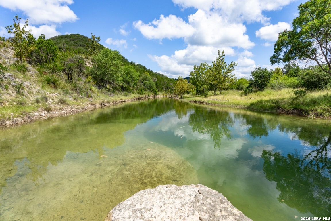 5013 North Little Creek Road Utopia, TX 78884 - Photo 9 of 39 a view of a lake with a yard