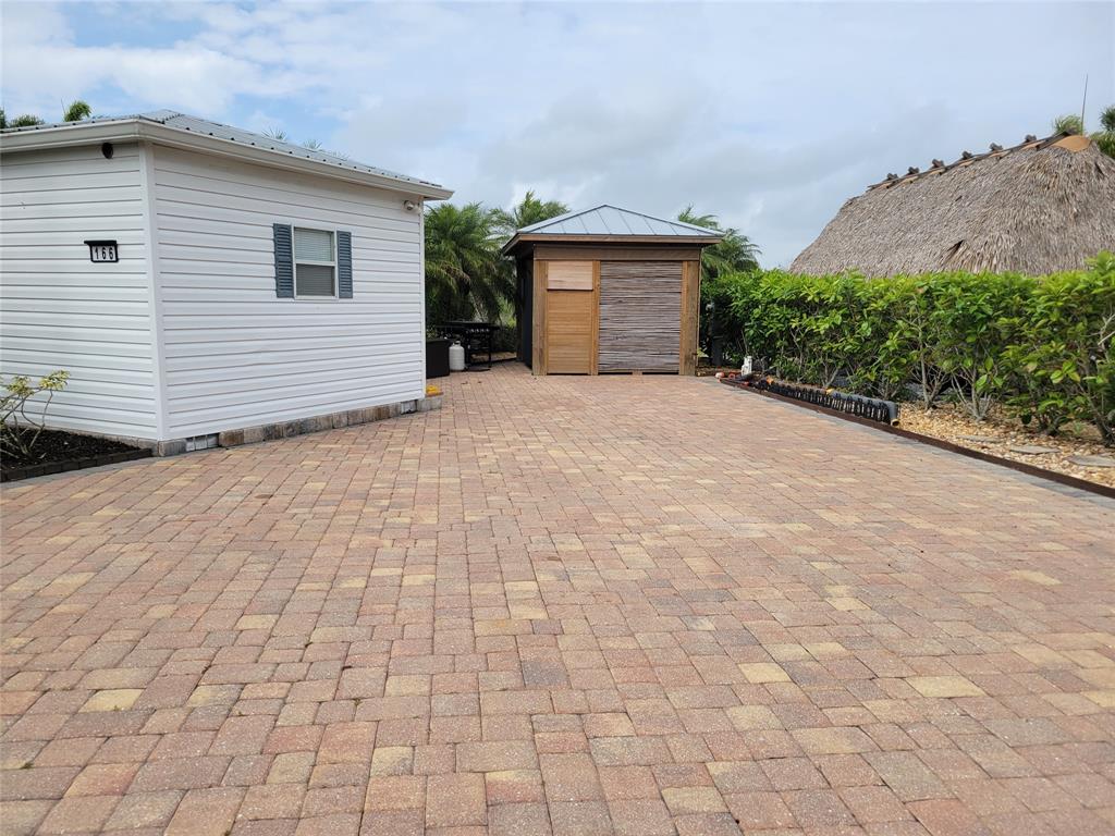 a view of a house with a yard and garage
