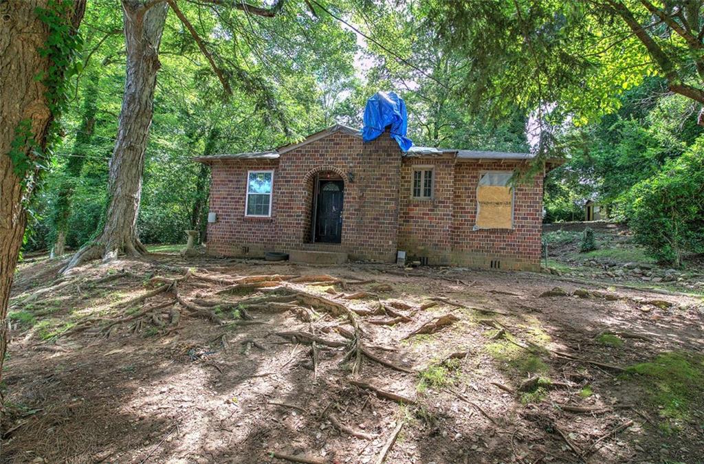 203 Church Street Northeast Rome, GA 30161 - Photo 1 of 1 a backyard of a house with lots of green space