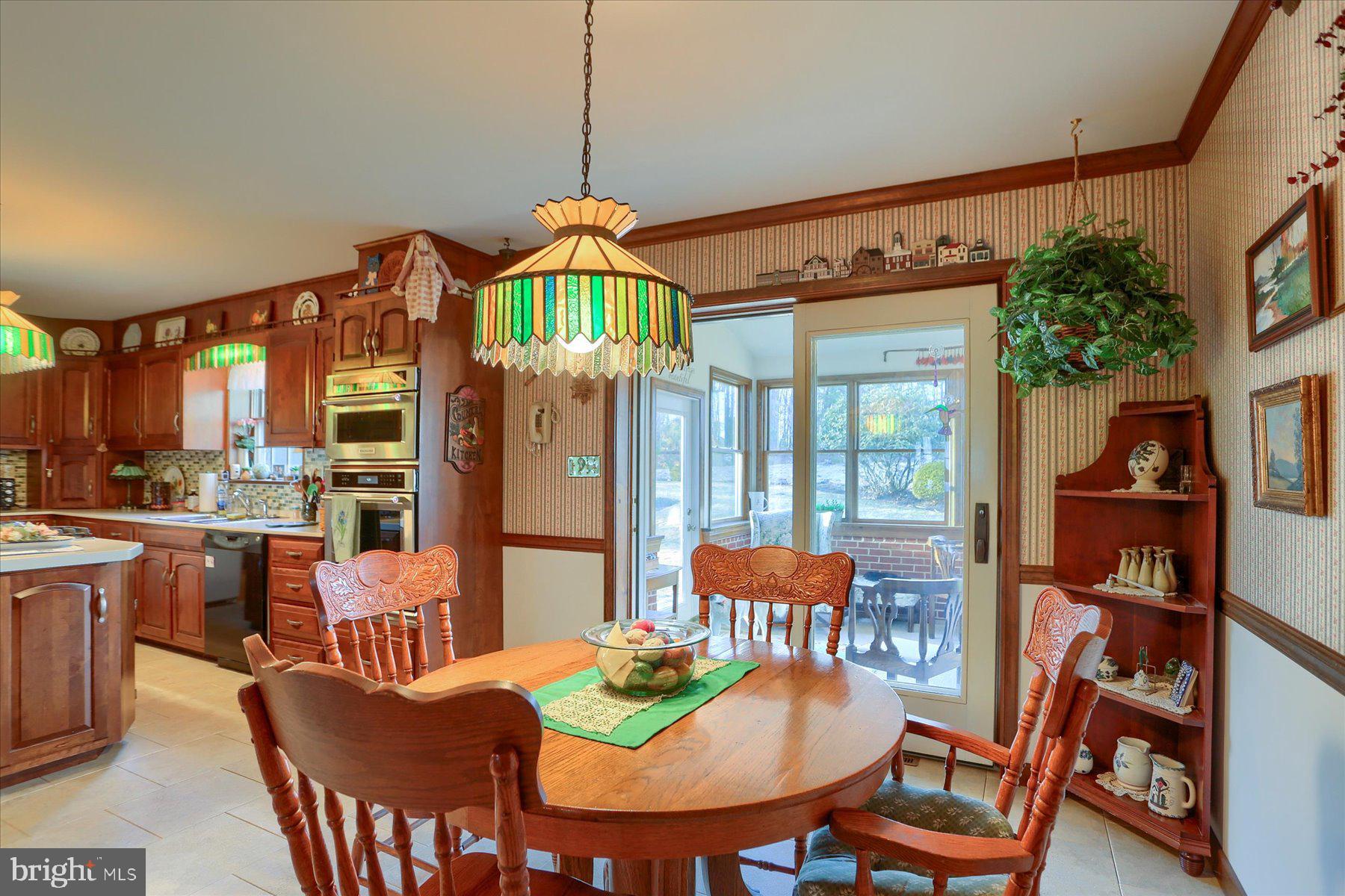1065 Kuhn Road Boiling Springs, PA 17007 - Photo 14 of 49 a view of a dining room with furniture window and wooden floor
