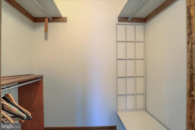 a living room with furniture and a gym machine