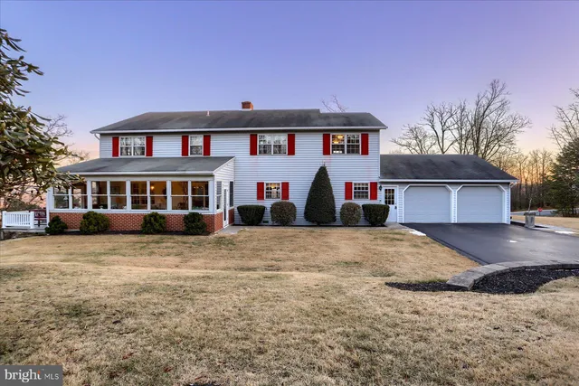 a front view of a houses with residential houses