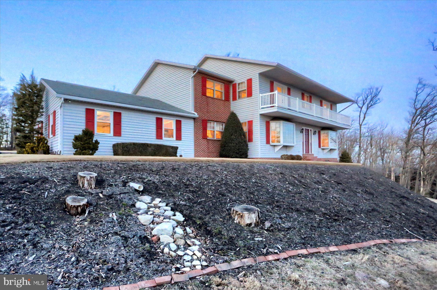 1065 Kuhn Road Boiling Springs, PA 17007 - Photo 45 of 49 a front view of a house with a yard