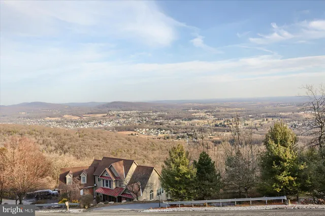 an aerial view of residential building and trees