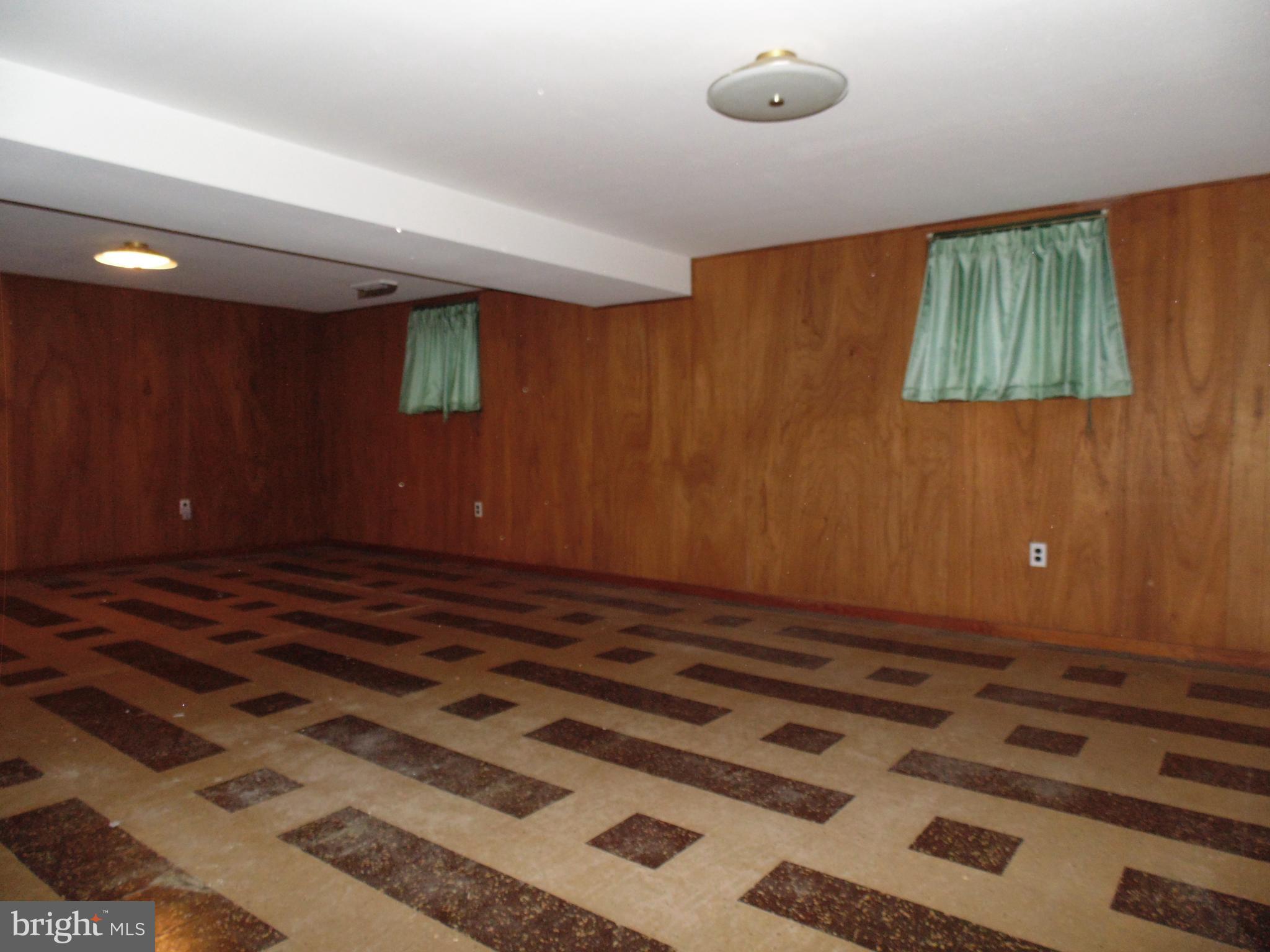 1407 North Rolling Road Baltimore, MD 21228 - Photo 14 of 18 Spacious Lower Level Club Room