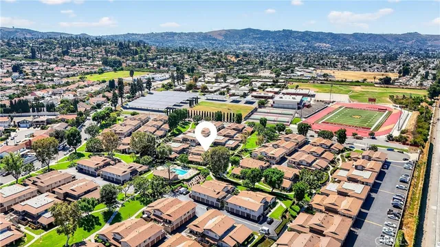 an aerial view of a houses and city street