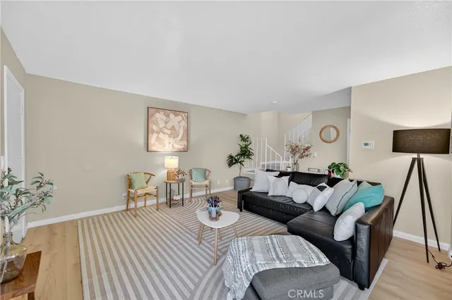 a living room with furniture and a table